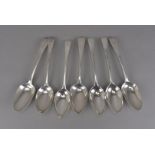 A harlequin set of seven George III silver tablespoons, bearing family crest to terminals, makers