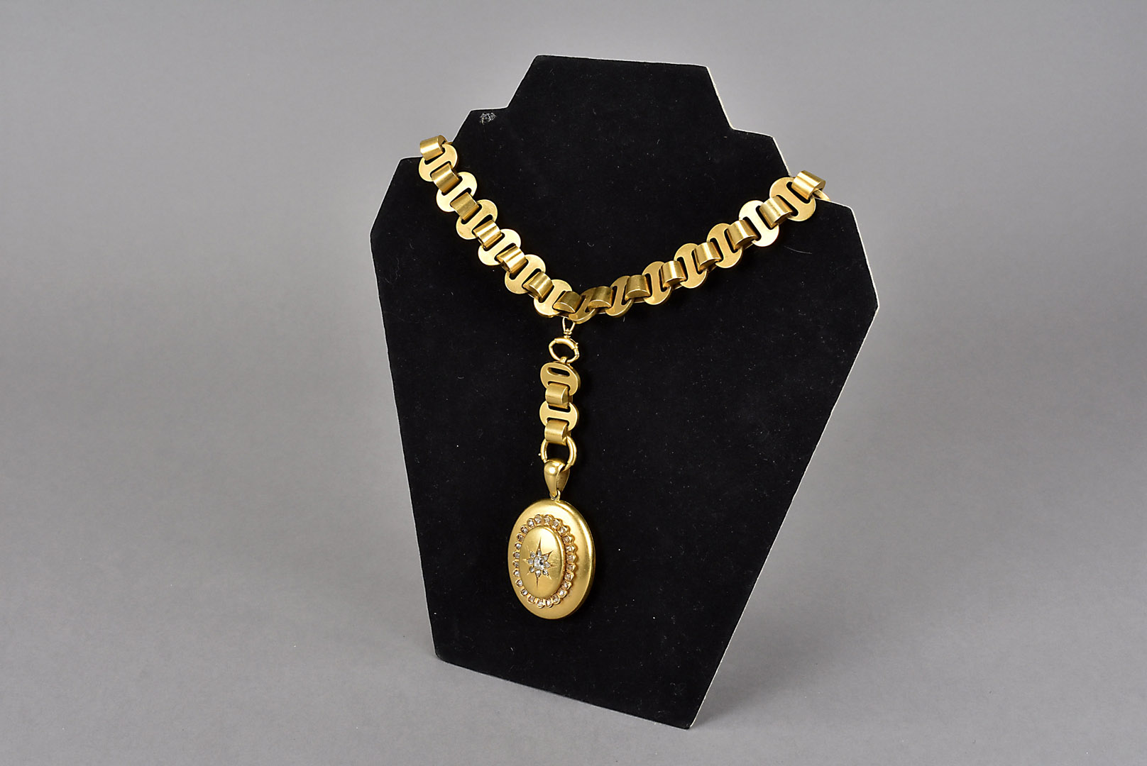 A fine Victorian choker necklace and diamond set locket, c1870s, the oval yellow metal locket,