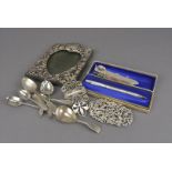 A collection of silver and white metal objects, including a Victorian fiddle pattern caddy spoon