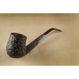 An Ashton 'Pebble Shell' Magnum briar estate pipe, of curved shape, marked to underside, Magnum