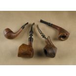 Four Danish briar estate pipes, comprising a freehand carved bowl with flared bowl and straight