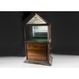 A Gallaher Ltd High Class Tobacco and Cigarette mahogany and glazed display cabinet, the table top