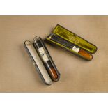 A Middle Eastern silver, ivory and amber cheroot holder,