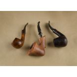 Three Danish briar pipes, including a Refbjerg, signed with curved stem, a sculpted example by