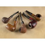 Four Italian briar pipes, comprising a Silvano sitter with red rustic bowl and marked stem, a Tom