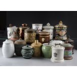 A collection of seventeen tobacco jars, including foreign and British examples, by LUC Saint,