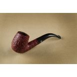 A Castleford unsmoked briar pipe, the sandblasted curved shape pipe, with logo marked stem, boxed