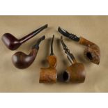 Four Danish briar estate pipes, comprising a cherry coloured Charles Fairmorn, Canadian shape marked