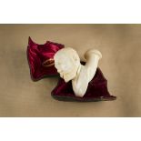 An impressive cased meerschaum pipe, the bowl carved depicting the Prince of Wales wearing winged