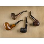 Three Charatan's Make briar pipes, with logo marked stems, together with an Italian Lorenzo birds