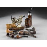 A small collection of novelty pipes, including a briar torpedo example stamped L'Atl Antide, a