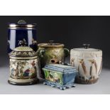 A collection of five pottery tobacco jars and covers, including a stoneware Doulton Lambeth example,