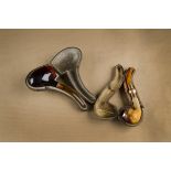 A meerschaum gold and amber cased pipe, curved shape bearing continental strike marks to the rim and