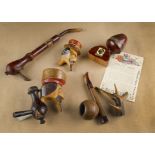 A collection of various continental carved figural pipes, with novelty comical faces and stems (