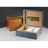 Two table top Humidors, one in a burr maple teal with a cross banded inlaid top, and another with