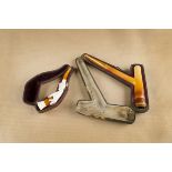 A cased meerschaum and amber cheroot holder, of pick axe shape with amber mouth piece together