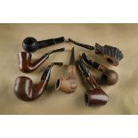 A collection of American estate briar pipes, including a Custombuilt rustic straight sitter,