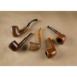 Five G.W. Sims briar estate pipes, two straight with tapered stems, bowl with smooth straight