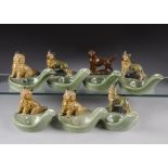 A set of seven Wade ceramic pipe rests, each modelled with various breeds of dogs (7)