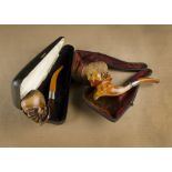 A carved meerschaum pipe, the figural bowl modelled as Russian youth, silver collar, amber