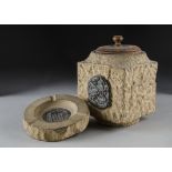 A WWII Houses of Parliament Portland stone tobacco Jar, of square shape with ceramic liner and oak