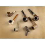 Three WWI carved pipes, dated 1914, 1916 and 1917 together with four other miniature pipes (7)