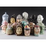 A large collection of fifteen glazed tobacco jars, including Jockey, devil, Men of the sea,