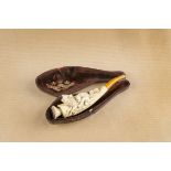 A cased meerschaum cheroot holder, the curved body with carving of a baby suckling from a shewolf