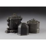 An early 19th Century cast iron tobacco jar and cover, of octagonal casket form together with an