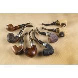 A collection of Petersons pipes and other Irish pipes, including two rustic briars with curved