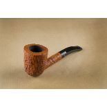 A Charatan's Make briar estate pipe, the sitter, with sandblasted finish, with curved shank marked