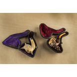 Two meerschaum and amber novelty cheroot holders, with figural carved bowls of bearded Turkish