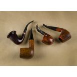 Four Butz-Choquin briar pipes, comprising a cherry polished Calabash, a Matire-Pipier De Luxe curved