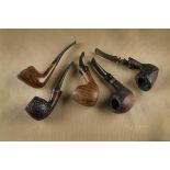 Five Danish briar estate pipes, including two Stanwell, three Bari examples all having logo marks to