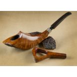 A Karel Krška briar estate pipe with stand and tamper, the free hand of horn shape with straight