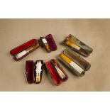 Six meerschaum and amber cigar holders, four with silver collars dating Birmingham 1899 and