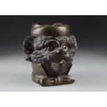 A bronze dog tobacco jar, the dog wearing a bow tie and collar, smoking a cigar and wearing a fez,