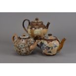 Two Doulton Lambeth Slaters Patent teapots, one with floral tube lined decoration, the other with