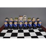 A Political Chess compendium, with caricature pieces representing Putin, Bhutto, Castro, Chavez,