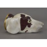 A 19th Century Staffordshire porcelain dog mask stirrup cup, with liver and white pattern, black