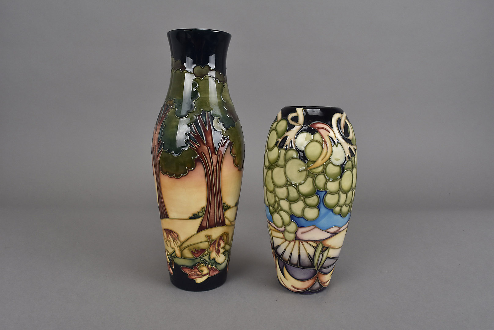 Two Moorcroft design trial vases, one of elongated baluster form and in the Country Trees pattern