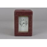 A 19th century French carriage clock repeater, 14 cm H, in burgundy leather case 15.5 cm H overall