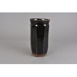 Shoji Hamada (1894-1978), a cut sided, or slab sided, vase in treacle glaze 23.5 cm H Bought at