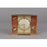A Jaeger le Coutre mantle clock, decorated in the Japanese style with cranes to a red ground 20.5 cm