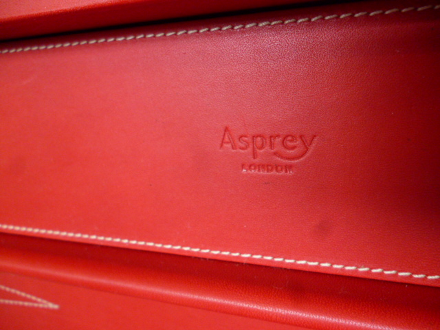 A red leather cased Asprey backgammon board, with leather counters and numbered die, marked Asprey - Image 8 of 8