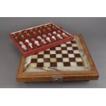 A modern teak and onyx chess set, 49 cm square