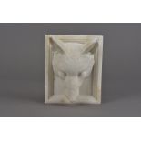 A 19th Century marble carving, modelled as a fox mask within a square stepped, inverted mount, 15.