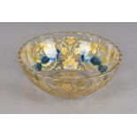 A 19th century Bohemian glass bowl, decorated with blue lustre peacocks within trailing gilt