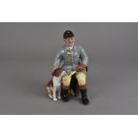 A Royal Doulton figure group The Huntsman HN2492, of a master and his beagle designed by M. Nicol,