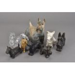 A collection of scotty dog models, including a Baccarat example, Belleek, two spelter, a brass
